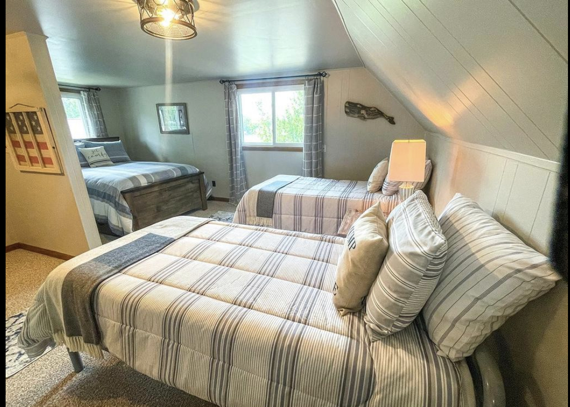 The upstairs bedroom with three beds